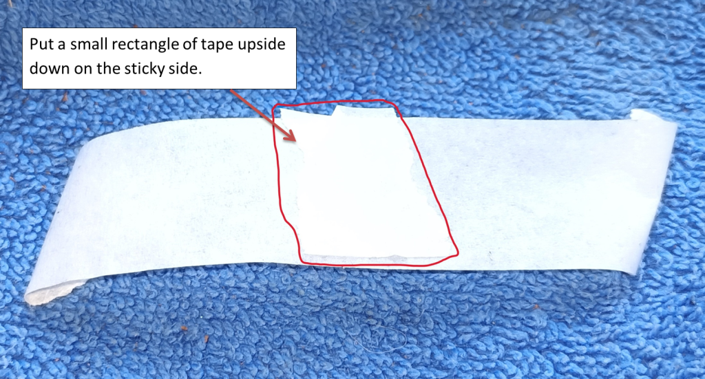 Make a non-sticky patch in a line of tape Tape with a non-sticky area