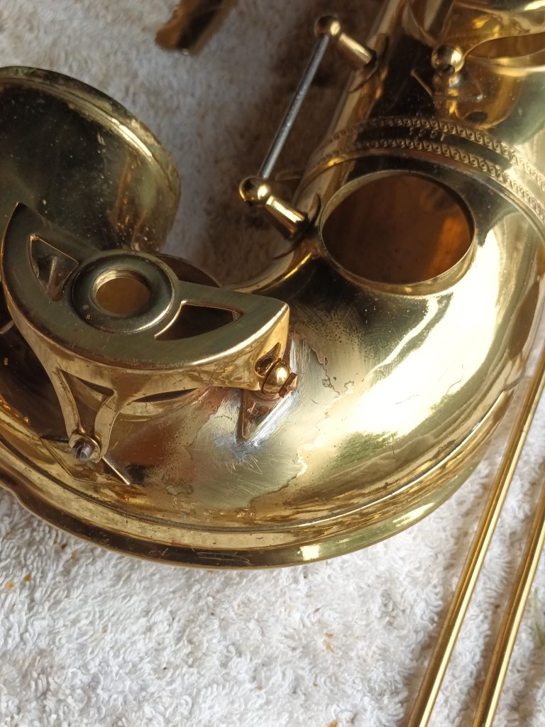 Replacement post fitted to saxophone New post fitted to saxophone